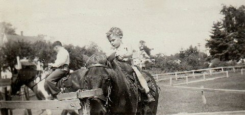 Two-year-old Cowboy Bob on a pony